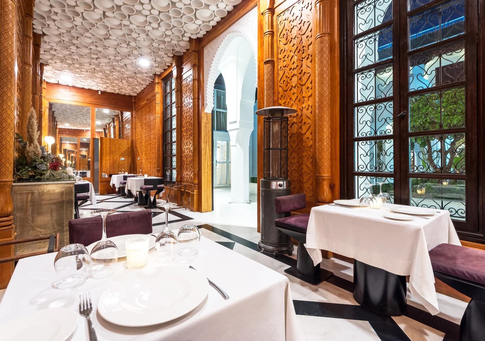 Warm wood patio restaurant at Riad Elisa