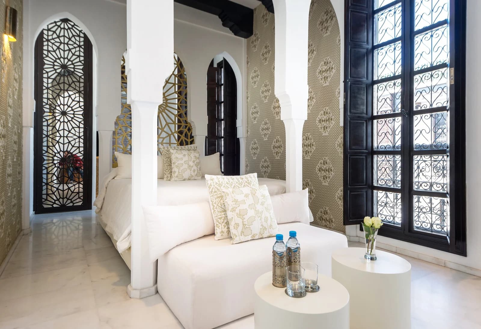 Junior Suite with white Moorish arches and geometric patterns